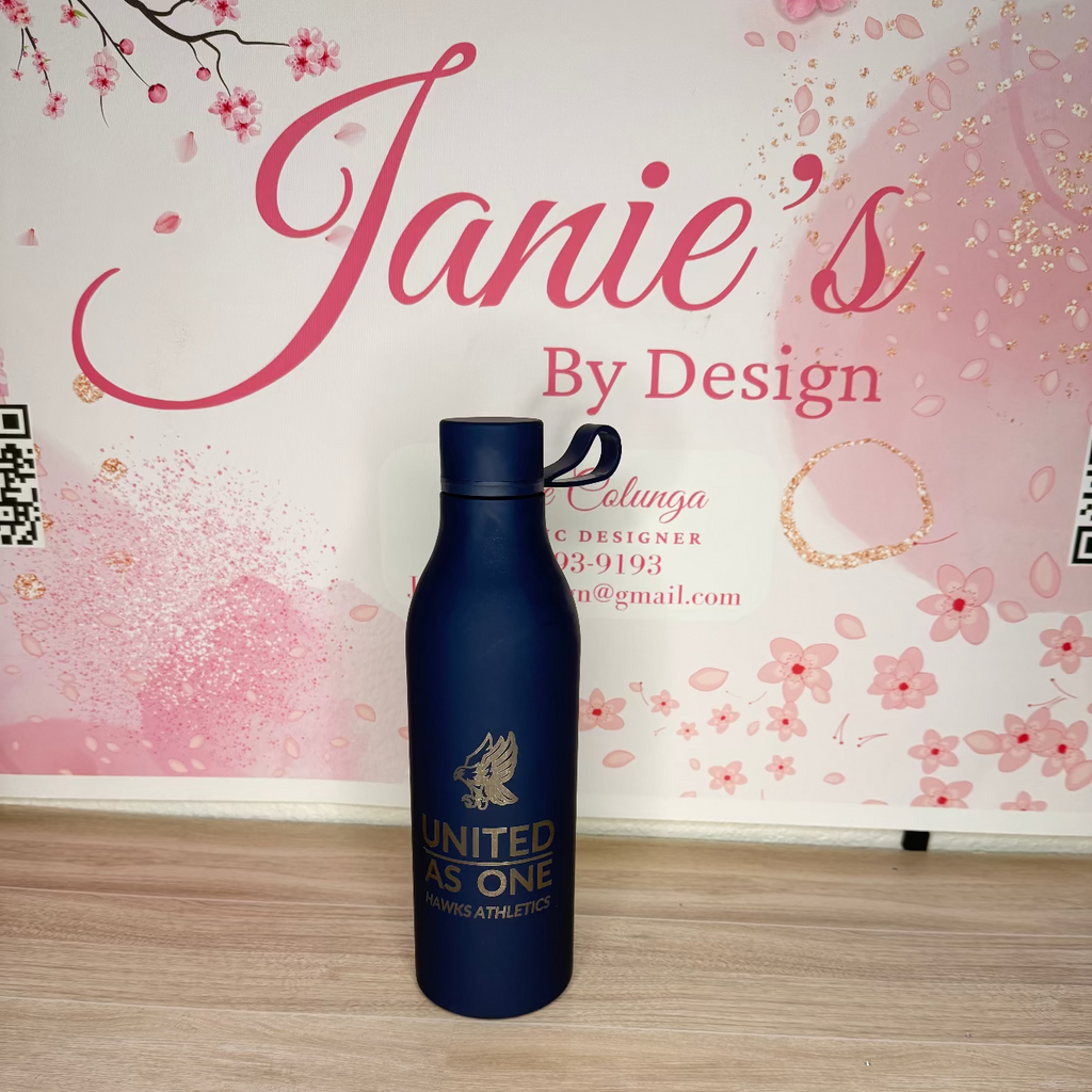 Blue water bottle with 'United We Are One' text on a wooden surface with a decorative background.