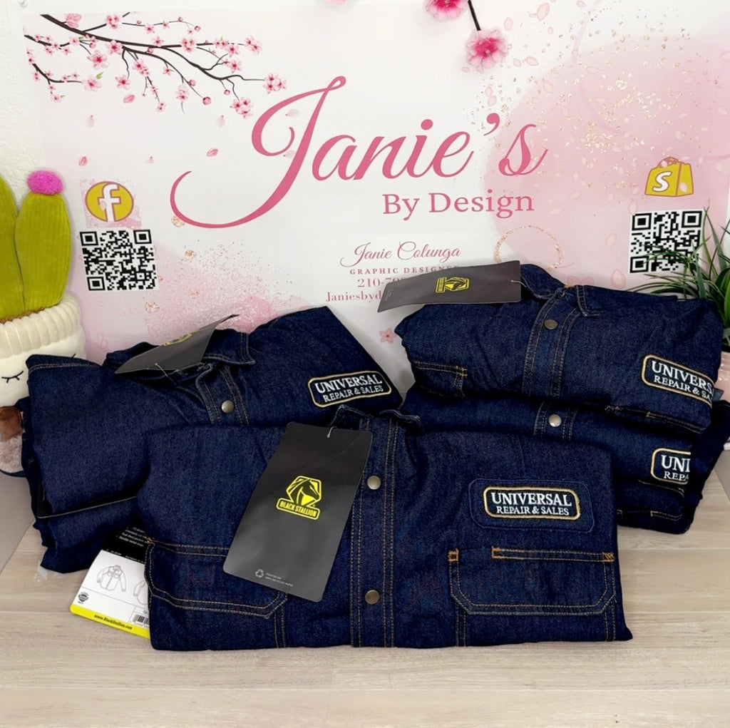 Stack of blue denim jackets with Universal Repair & Sales tags on a light pink background with cherry blossoms.