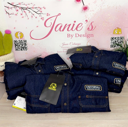 Stack of blue denim jackets with Universal Repair & Sales tags on a light pink background with cherry blossoms.