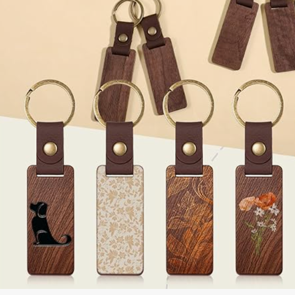 Set of wooden keychains with various designs on a neutral background