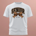 A white short-sleeve crewneck t-shirt with a graphic on the front featuring the word 'SENIOR' in arched brown letters with leopard print outlines, a matching leopard print bow, and 'EST. 2027' written below, shown against a solid dusty rose background.